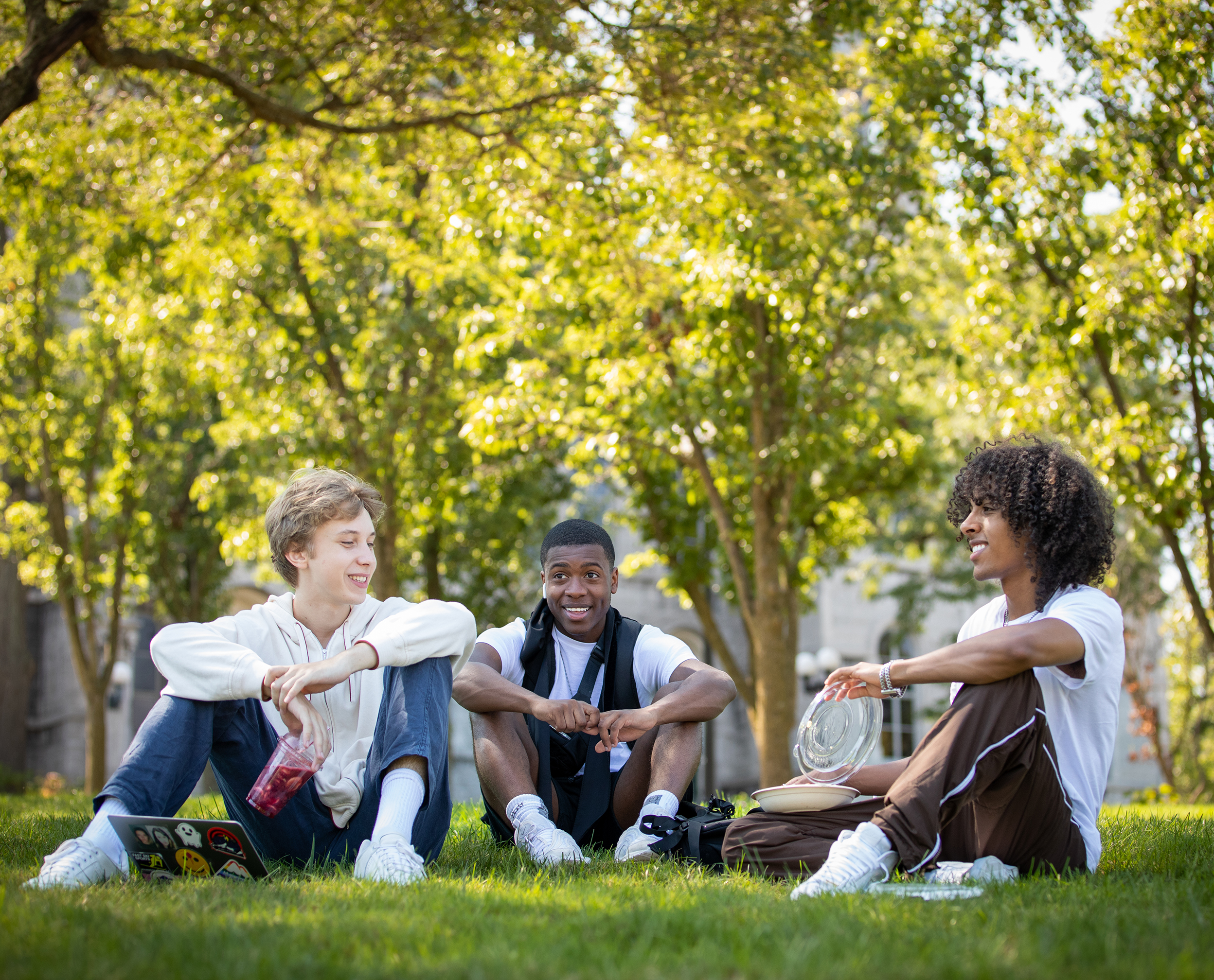 Syracuse University students sitting on the quad